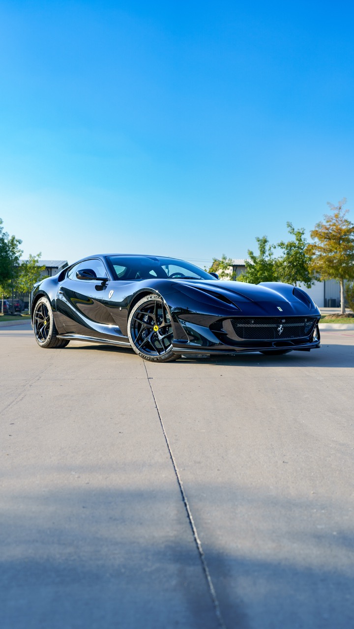 Factory Corsa Red converted with full-body Ultra Gloss Piano Black color PPF, delivering a deep mirror finish with added impact protection. Installed edge-to-edge with seamless execution. Yellow calipers and wheel caps retained as signature Ferrari contrast.