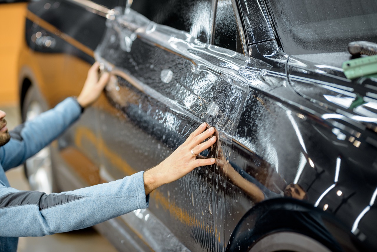 Hydrophobic paint protection film being installed onto a vehicle
