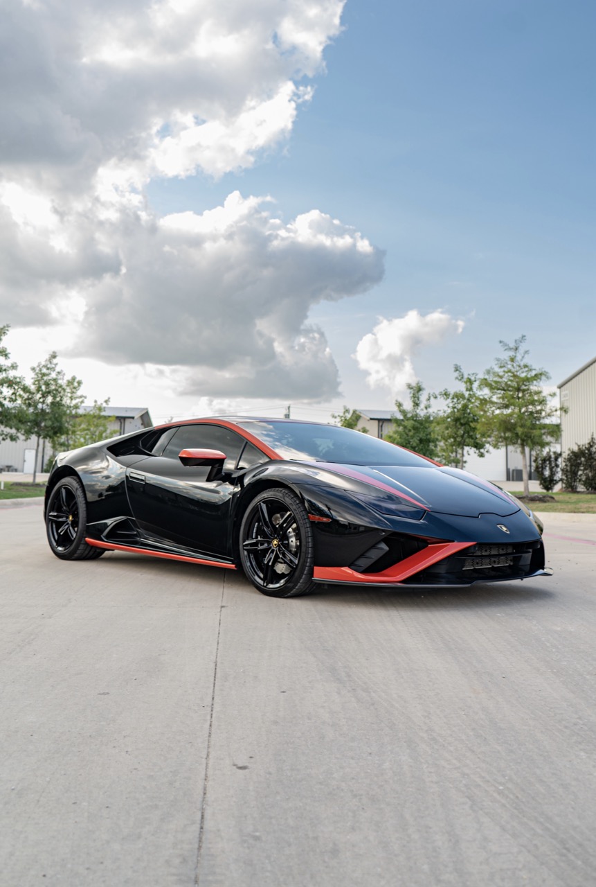 Factory Nero Noctis converted with full Hot Rod Red vinyl wrap, sealed with PPF for added durability and protection. Installed edge-to-edge with clean execution. Carbon fiber PPF trims retained to sharpen contrast and detail.