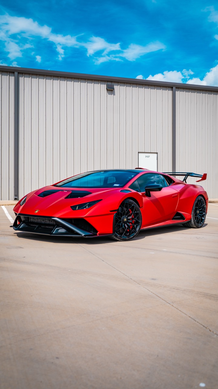 Factory Nero Aldebaran reimagined with a full Satin Chrome Red vinyl wrap, sealed with PPF for added durability and protection. Edge-to-edge installation with controlled seams. Matte black trim and smoked headlights sharpen contrast and aggression.
