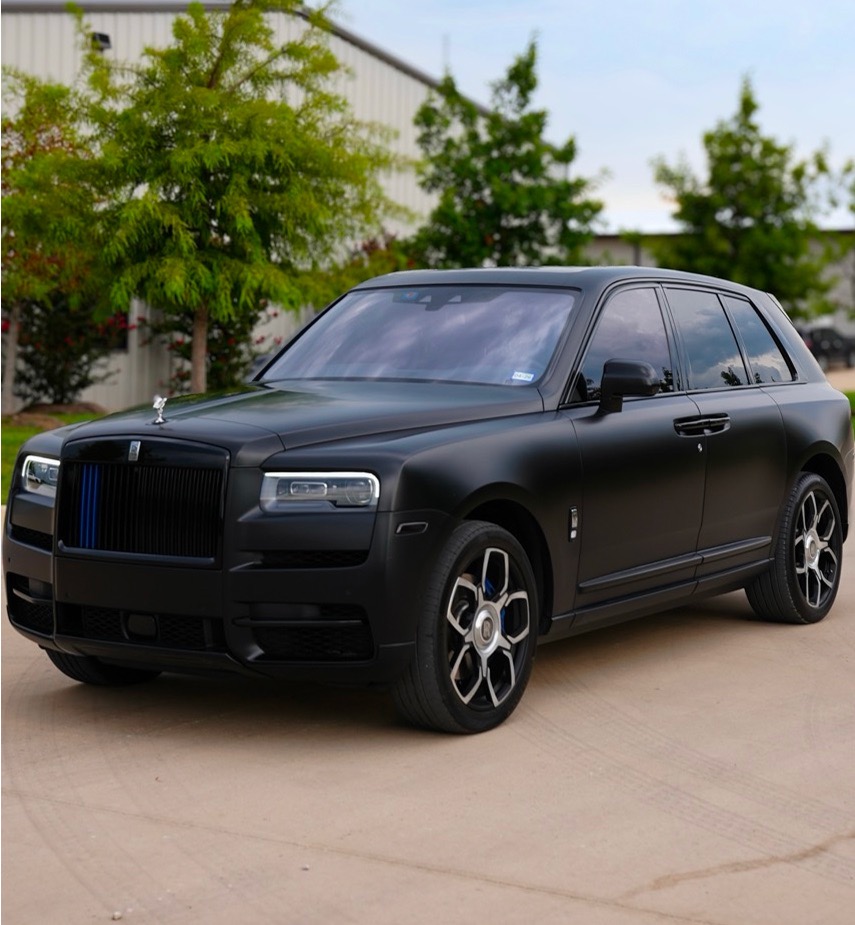 Rolls-Royce Black Badge fully murdered out with full-body Matte Black Paint Protection Film, creating a stealth finish while adding complete surface protection. Interior upgraded with custom blue stitching to introduce subtle contrast, paired with matching blue brake calipers to tie the exterior and interior together with a precise performance accent.